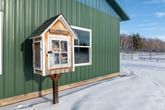 Free library box sits along Grand Lake for community book sharing.