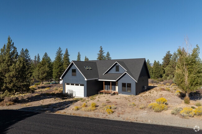 A modern ranch-style home sits among tall pines near Lake Shastina in Siskiyou County.