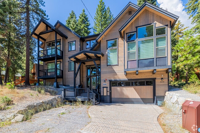 A large mid-century modern with large windows in Carnelian Bay.