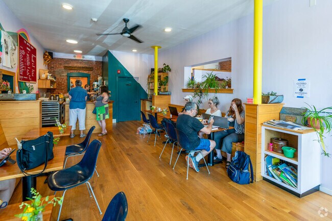 The Upper Bend in Turners Falls is a cozy coffee shop known for vibrant decor and a welcoming atmosphere.