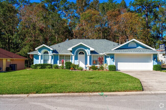 A vibrant blue hue adds a pop of color to this single-family Broadmoor home.