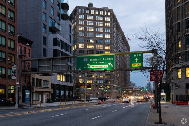 The mouth of the Holland Tunnel, which terminates in New Jersey, is in Hudson Square.