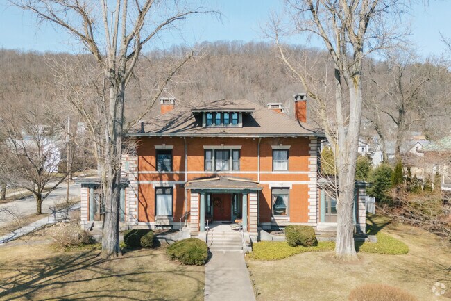 Homes in Warren like this American Foursquare often sit on narrow lots, you can find homes with larger lots as well.