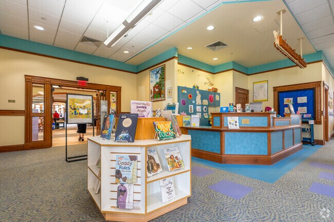 The children's section of the Chicopee Public Library has colorful walls and picture books.