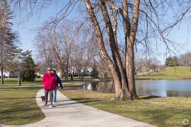 There is a paved walking path circling the pond at Richmond Park in Grand Rapids.