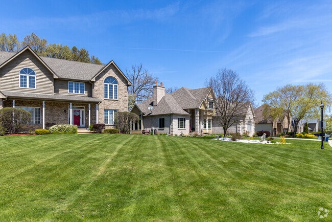 New traditional homes line manicured lawns in The Links of Midlane in Waukegan.