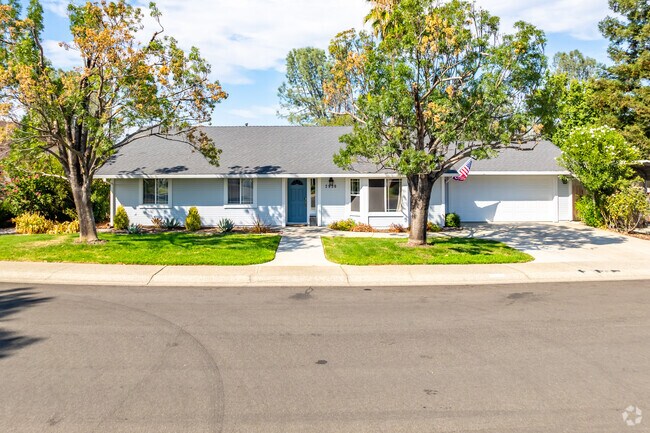 Single family homes with lush green lawns are common throughout Panorama.