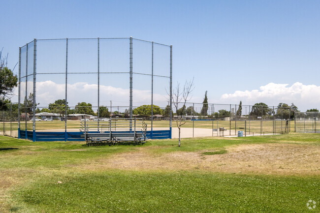 Children learn teamwork on the  baseball field at Scandinavian Middle School in McLane, Fresno.