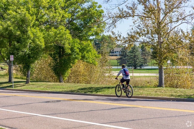 Cyclists enjoy the wide residential roads in Legacy Ridge.