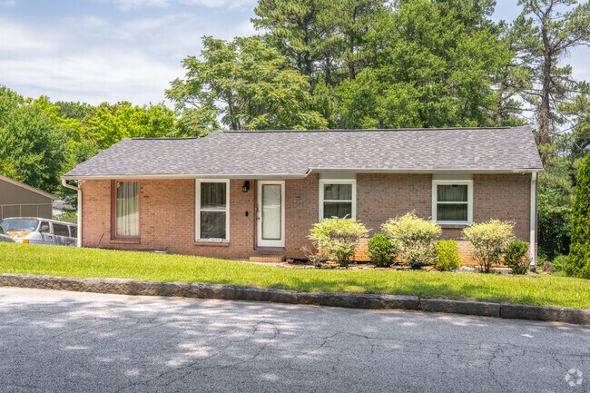 Brick ranch homes in Fairburn Heights sit back on lots with well maintained landscaping.