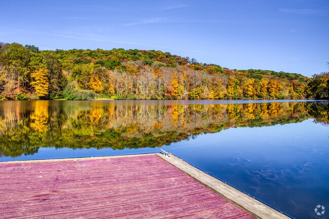 The colors of autumn reflect in the lake at Raccoon Creek State Park.