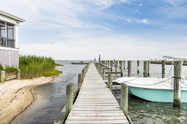 The dock at Captain's Cove provides easy water access and leisure in Greenbackville’s waterfront community.