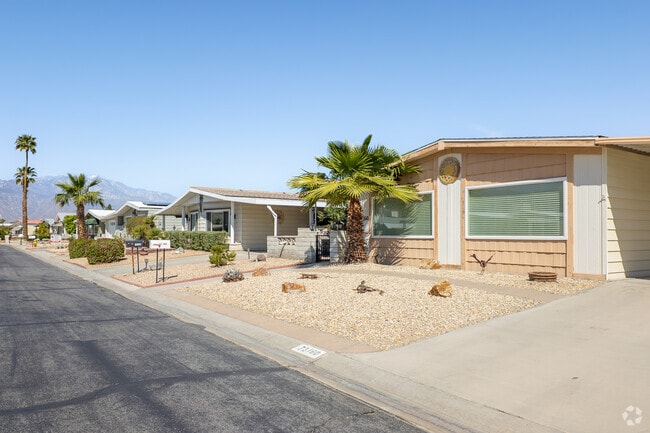 Charming manufactured homes in Palm Desert Greens Country Club offer peaceful views.