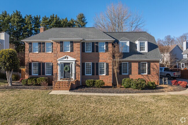 In Quaker Run, a brick 2-story Traditional home sits on a spacious lot.