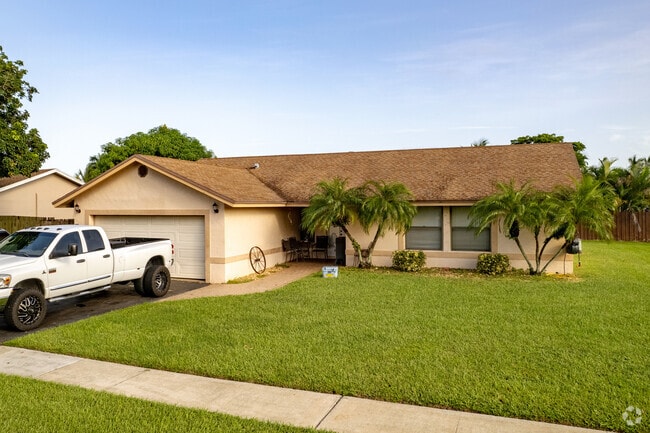 Ranch-style homes line the streets of Boca Lago Country Club in Boca Raton.