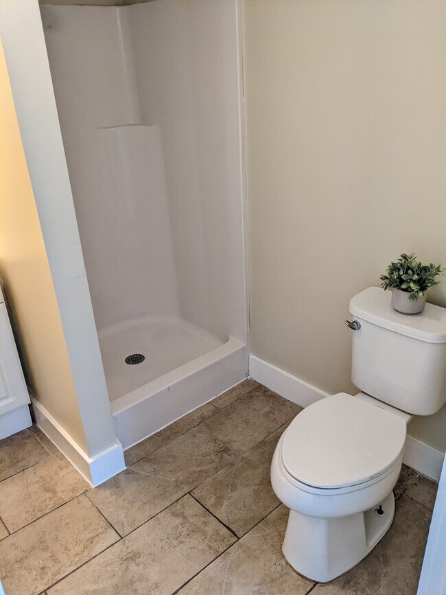 Bright, spacious bathroom with shower