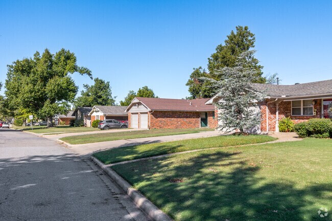 Most homes in Parmelee have tall wooden privacy fencing enclosing spacious backyards.