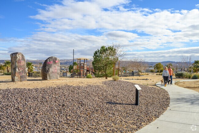 A paved walking path in Petroglyph Park leads to rock carvings and informational displays about Ridgecrest's ancient history.