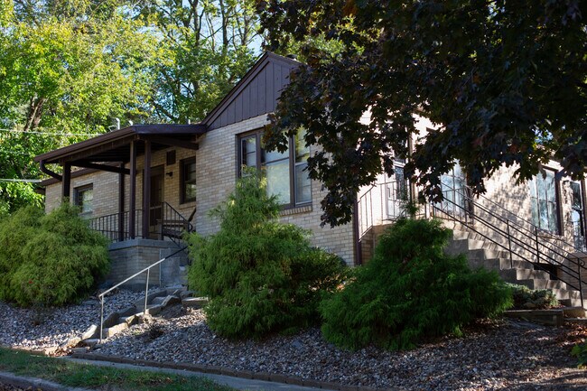 Nice Breakfast porch on the side. watch the neighbors walk by
