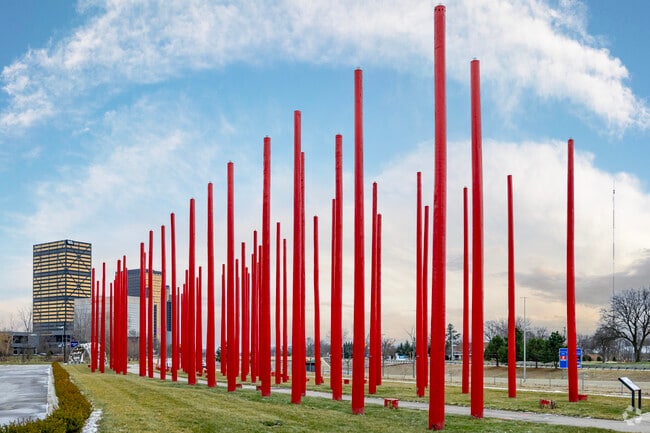 An urban pathway follows along the path of Southfield's Lodge freeway and past local art.