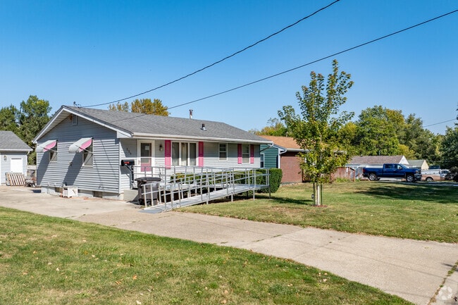 Ranch homes in Watrous Heights sit close together, offering wide driveways for easy parking.
