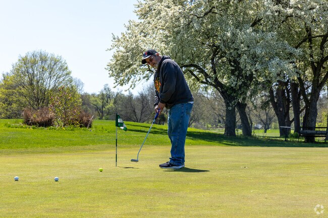 The River Pointe public country club in Ainsworth has a practice green and driving range.