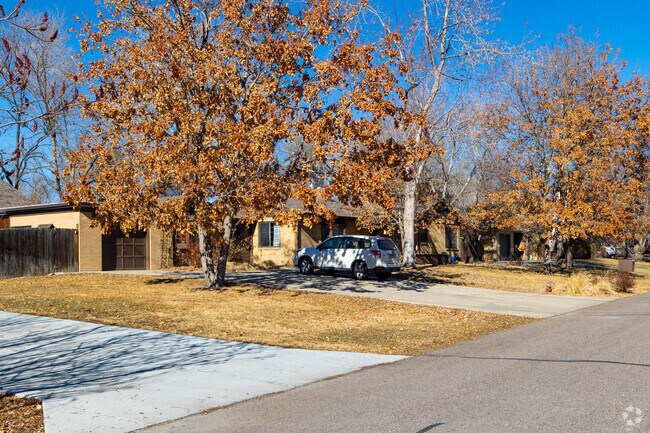 Some more modest brick-ranch homes sit on tree-lined streets.