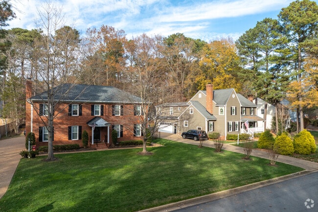 This beautiful brick colonial-style home is found in quiet Tuckahoe Village.