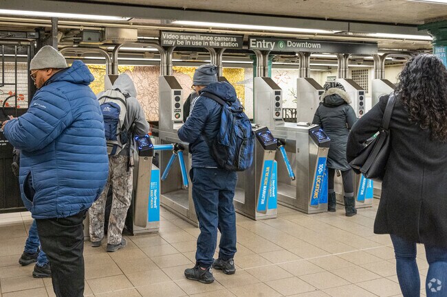 The 6 train stops at 77th street near Metropolitan Hill.