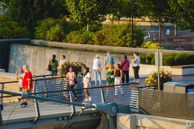 Riverside Crossing Park is a popular place to watch the sunset.
