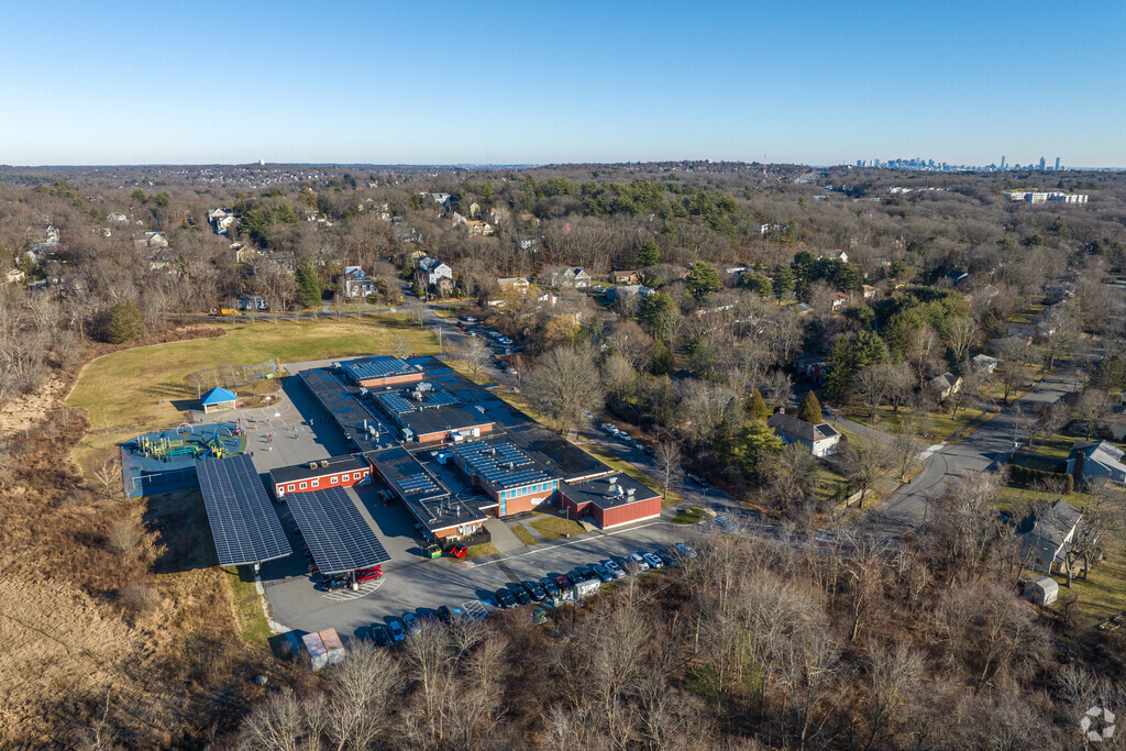 Bowman Elementary School in Lexington, MA with the Boston skyline in the background.