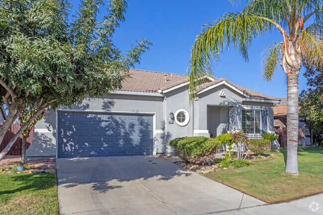 Palm trees are just one of the ways residents of South Dos Palos landscape their yards.