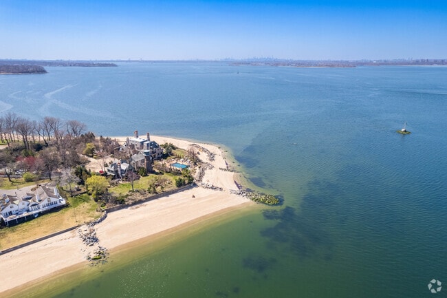 The New York City skyline is visible from the southern tip of Sands Point.