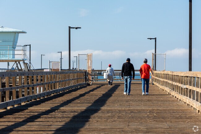 morning walkers on pier