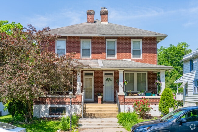 Large brick twin homes have spacious interiors and provide ample yards in Paxtang.