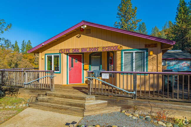 Wooden stairs lead to Live Oak Waldorf School entrance.