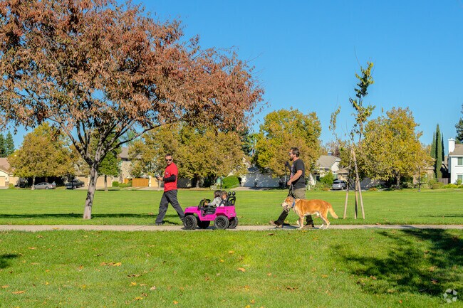 Two friends take the children for a walk through Toby and Sue Johnson park.