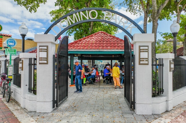 Enjoy a game of dominos, a traditional game in the community.