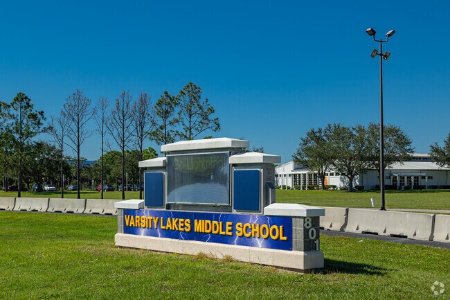 Varsity Lakes Middle School welcomes students with a large sign, and private driveway.