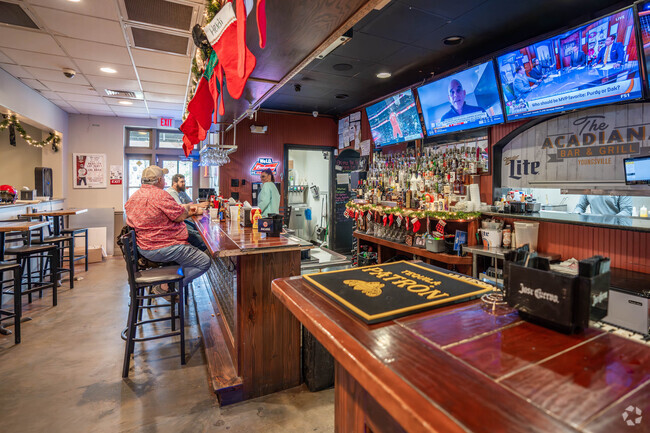 Residents of Youngsville enjoy cold drinks and pub grub at Acadiana Bar and Grill.