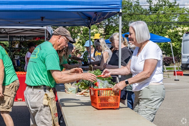 Residents of Churchill shop for locally grown produce at the Forest Hills Farmers Market.