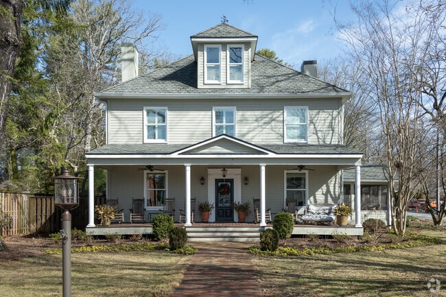 Large homes, such as Colonial Revivals, sit on larger tracts of land in Brevard.