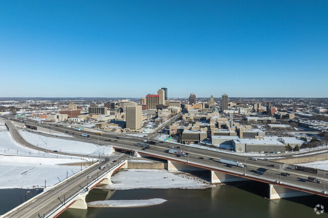 The Miami River gently flows around the hustle and bustle of Downtown Dayton.