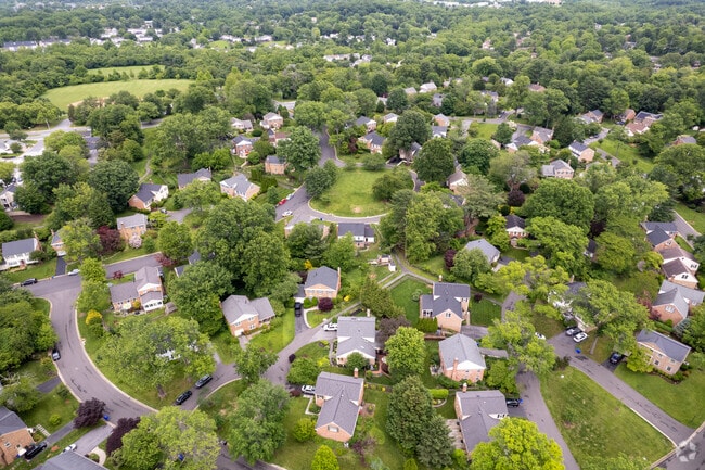 Tall trees and green spaces create comfortable living spaces in the area.