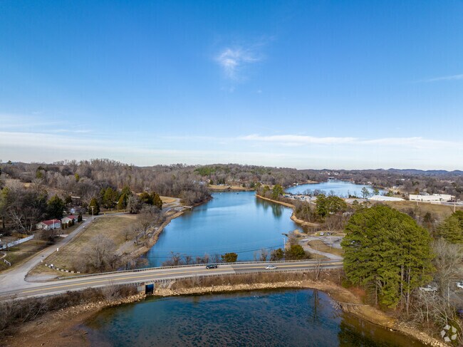 The park and lake in Louisville have a road that runs through the area.