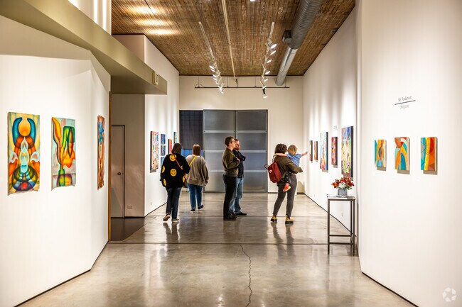 Families, friends, and strangers enjoy the art galleries on Baltimore Avenue in the Crossroads area.