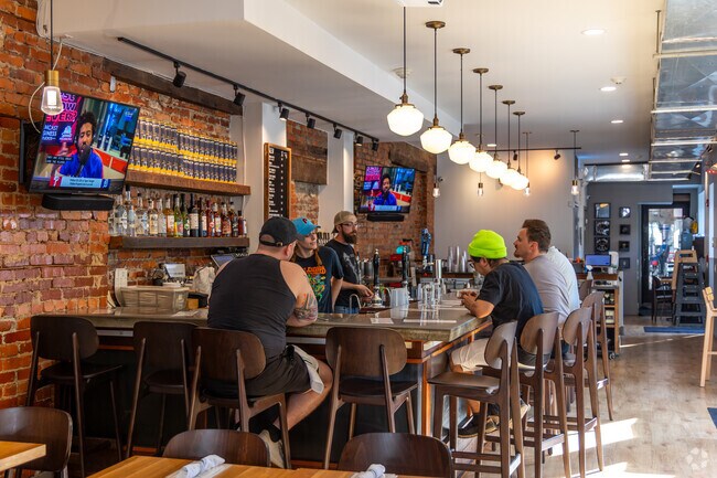 Grab a happy hour drink at New Ridge Brewing Company in Roxborough.