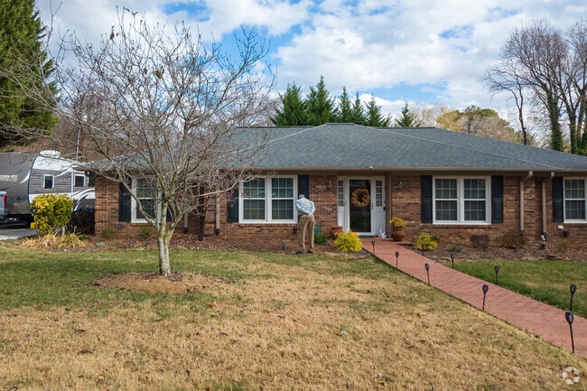 A resident thoroughly checks his garden in Aldbrige-Heather Hills.