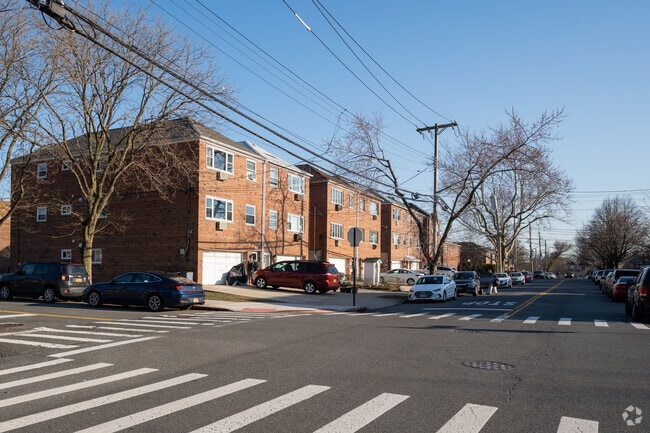 Attached brick-faced homes form a harmonious urban landscape in Middletown-Pelham Bay.