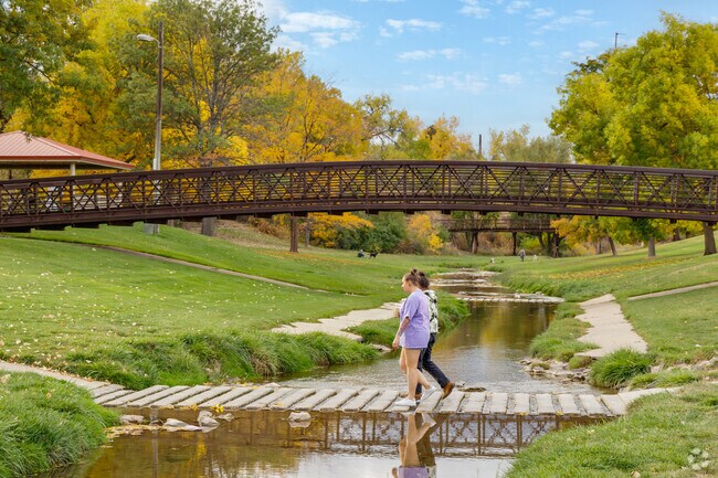 Friends walk along the picturesque trails at Belleview-Cornerstone Park.